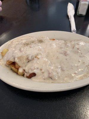 One biscuit with sausage gravy and home fried potatoes.  You can't go wrong