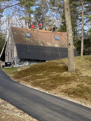 Lane Roofing employees start stripping my roof.