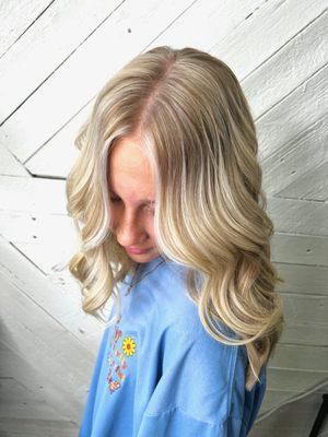 Full head of highlights with a small money piece to bring brightness around the face.