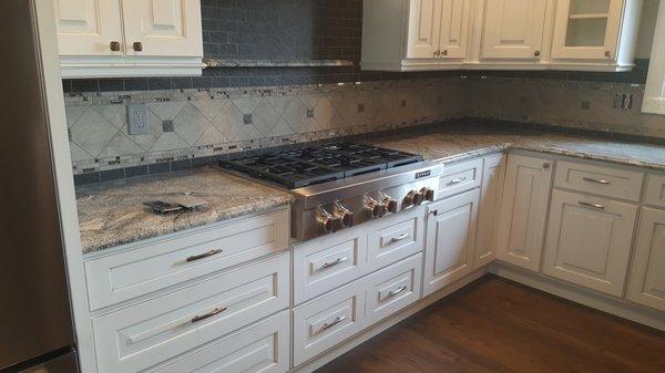 Custom tile backsplash.  Ask about your dream design!