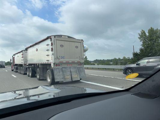 Truck with blowing cover and my cracked windshield after trying to pass it on freeway