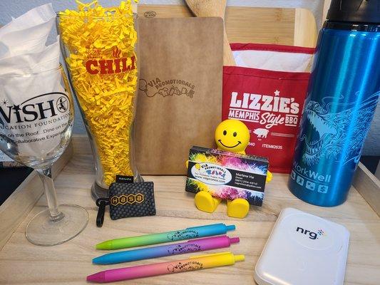 We can imprint on a variety of items with YOUR logo! Beverage containers, notebooks, eyeglass wipes, pens & chargers are just a few of them.