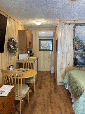 The Dogwood Room with 2 Double Beds, Kitchenette, & private Bathroom with walk-in shower.