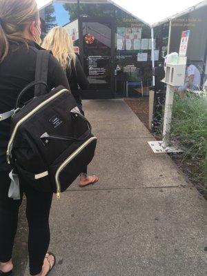 100+ degrees out, long line, no water, no help or person checking anyone in...