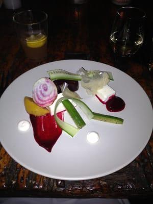 Roasted beets, hearts of palm panna cotta, compressed cucumber, potato, and roasted garlic mayo.