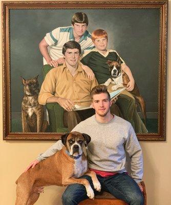 Keegan posing with his Boxer dog Tyson.