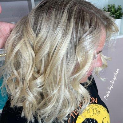 Reverse balayage to blend harsh line of demarcation on blonde hair for seamless blend