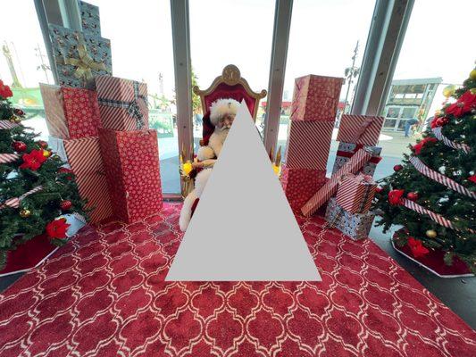 Santa photo with outside background - triangle shape added for privacy