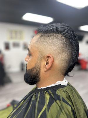 High bald Mohawk fade with beard enhancement and line up