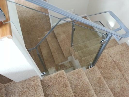 Customer Photo: Sunrise Glass Company install - custom tempered guardrail glass on open staircase remodel. Perfect.