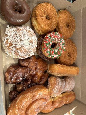 Coconut, chocolate chocolate, cinnamon roll, apple fritter, glazed twist, crumb, maple bar, chocolate old fashioned, and sugar twist.