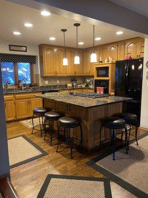 These are the old kitchen cabinets. The old ones were golden oak, and the new ones are called "oyster" colored with a cappuccino glaze.