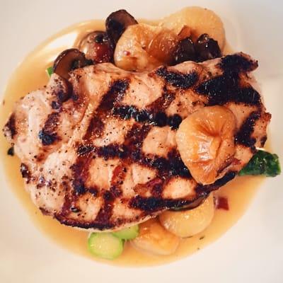 Grilled country pork chop with mushrooms, cippolinis, asparagus, bacon and marsala