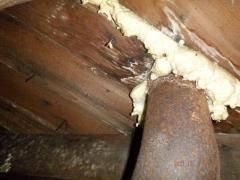 Stains on subflooring visible in crawl space