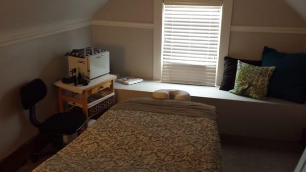 Cozy massage room.  Every massage uses hot towels, hot stones, and essential oils.