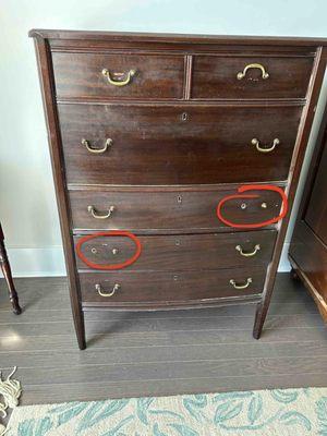 Missing handles on antique bureau