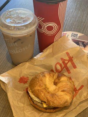 Sausage, egg, and cheese on a croissant; Iced Chai Latte; & XL Black coffee