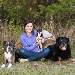 Co-Owner/Operator, Nicole Meyer with her pack, Bentley, Chica Bonita & Trooper. Coming up on 15yrs of experience in doggy day care!