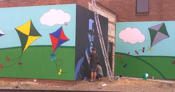 After community involvement helped paint the mural, artist Danny Causey had to finish up the detail work in 2017