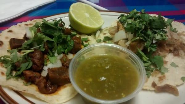 Al pastor and carnitas tacos left to right respectively