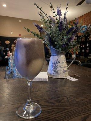 Wine slushee. Twisted grape (tastes like cool aid) and peach. Delicious! With a floral display that's for sale.