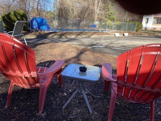 Ashtrays setup in common areas by pool.