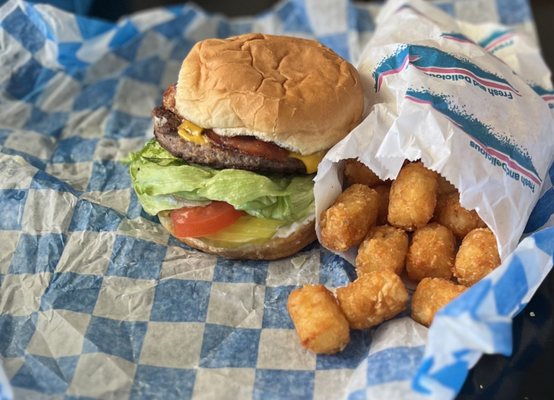 Cheeseburger added bacon with a side of tots