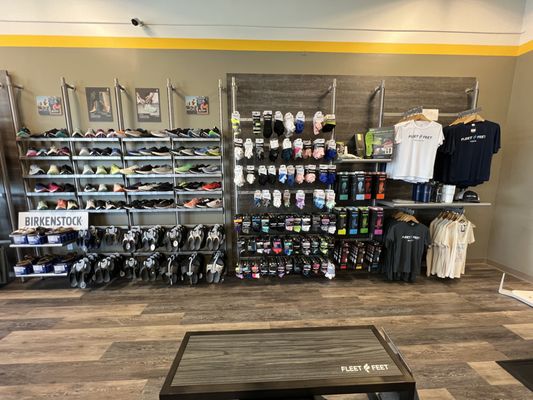 Shoes, socks, and Fleet Feet Branded apparel selection.