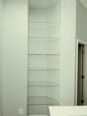 Custom glass shelves for a display nook.