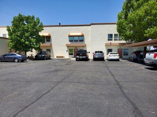 Parking lot, center door entrance,  overflow parking shared with church next door.