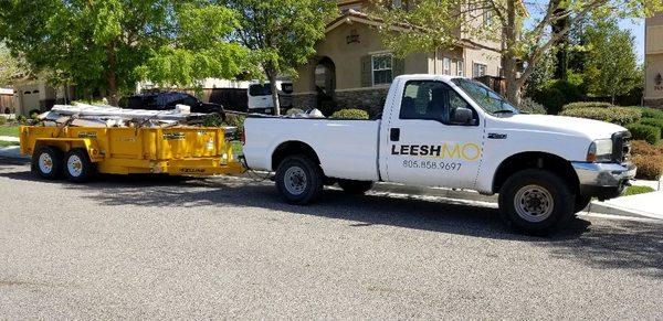 Hauling away a wooden rotted deck.