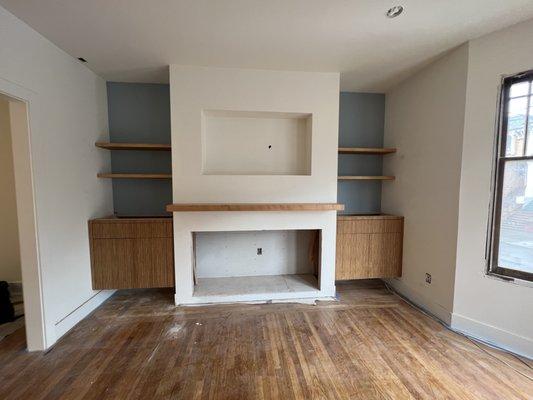 Floating cabinets, shelves and fireplace