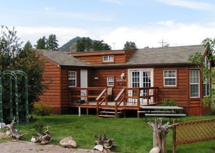 This is Cabin #4, Ponderosa Place. All of our cabins have a deck, picnic table and Charcoal grill.