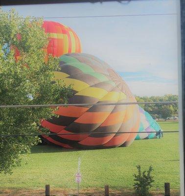 The Balloon Fiesta comes to us every year! Here's the view of the soccer fields from our office.