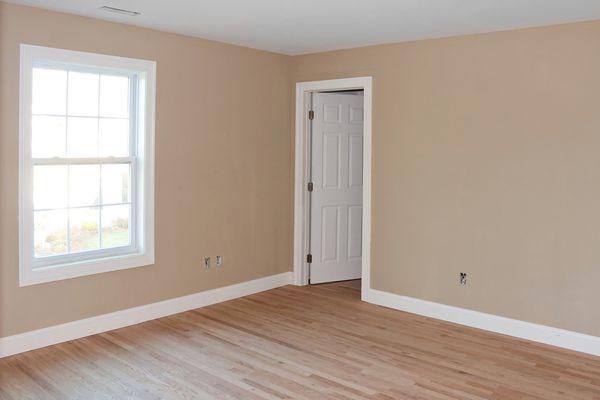 Whole room renovation: painting, drywall, new door, laminate flooring