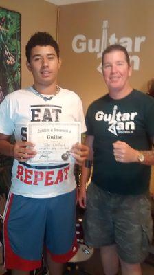 Tyler -Teen Turn Around Graduate with Instructor GuitarZan