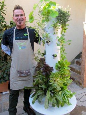 Farmer Joe proud happy educator of growing sustainable food with a compact efficient and sustainable Tower Garden