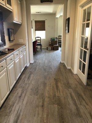 Finished job Looking from front door to great room. Porcelain tile that looks like wood.