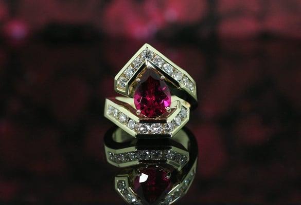 Rubellite and diamond ring set in yellow gold.