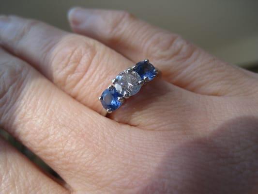 Raffie found a pair of sapphires and a platinum setting to reset my diamond.