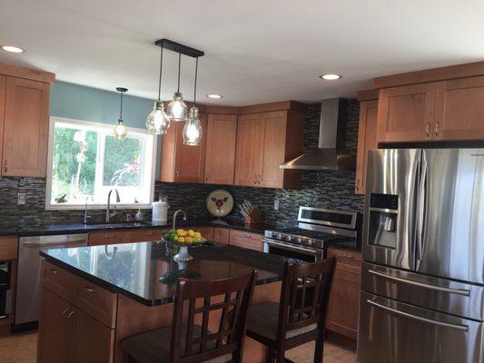 Granite counter tops and Shaker cabinets.