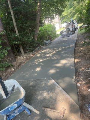 10 feet by 20 feet of concrete driveway was ripped out and repoured to fix uneven surface.