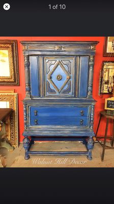 A vintage Jacobean China Cabinet refinished in a bohemian theme with paints and metallic waxes.