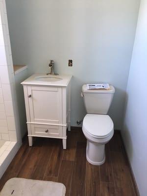 New vanity and toilet part of a bathroom remodel