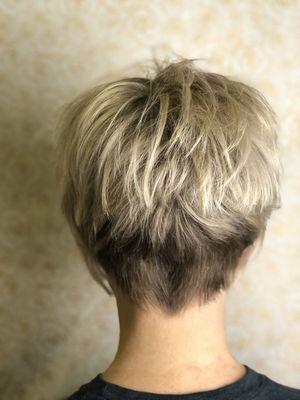 Textured stacked cut with ice blond highlights.