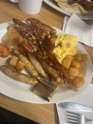 Buttermilk pancake, French toast, scrambled eggs, sausage, bacon and potatoes