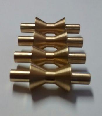 Brass rollers turned on CNC lathe.