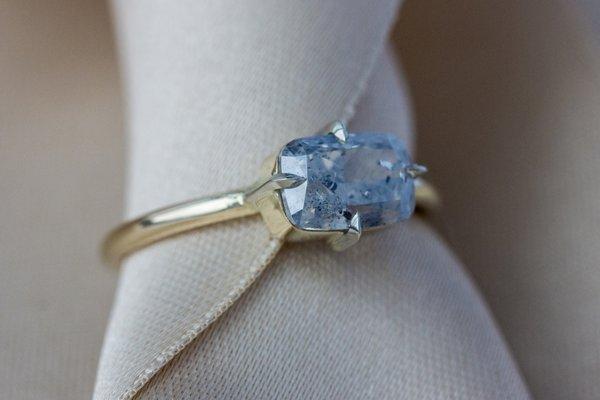 Fluorescent blue diamond solitaire