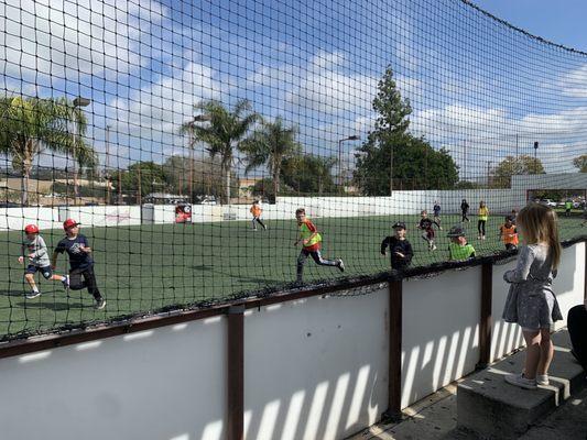 Kids playing in the larger arena field