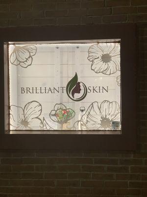 Brilliant Skin's smaller display Central Avenue window at night